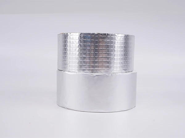 A roll of smooth aluminum foil butyl tape and a roll of checkered aluminum foil butyl tape