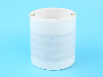 A roll of butyl sealant tape is lying on the blue background.