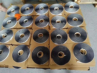 Many Butyl windscreen sealants are neatly arranged on top of the cardboard box