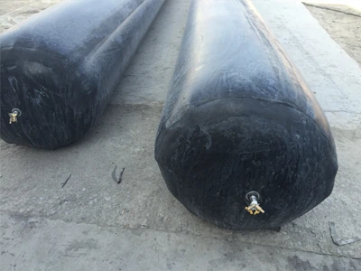 2 inflated rubber inflated culvert balloons