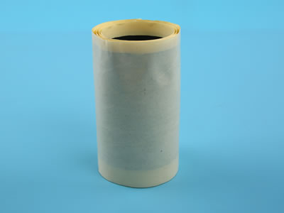 A roll of single sided butyl tape in large size is lying on the blue background.