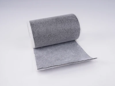 A roll of non-woven butyl tape placed horizontally