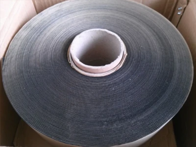A roll of finished non-woven butyl tape is placed inside the carton.