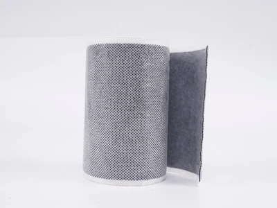 A roll of non-woven butyl tape placed vertically