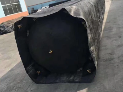 A rectangular rubber inflated culvert balloon placed on a cement floor